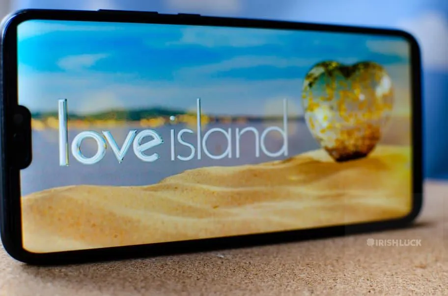 Love Island TV show - logo on the smartphone screen.