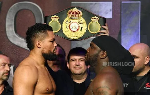Joe Joyce (left) and Bermane Stiverne during the weigh in at the The O2, London.