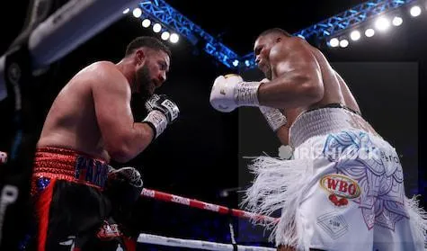 Joe Joyce (right) in action against Joseph Parker during their vacant WBO Interim World Heavyweight Championship contest at the AO Arena, Manchester. Picture date: Saturday September 24, 2022.