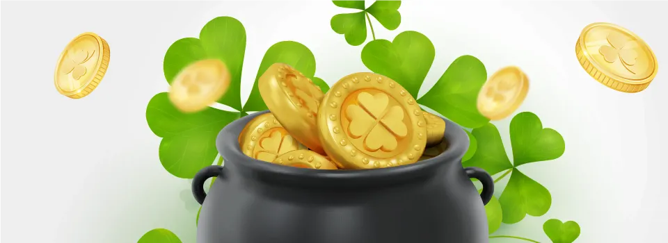 image of a black pot full of golden money in front of shamrock